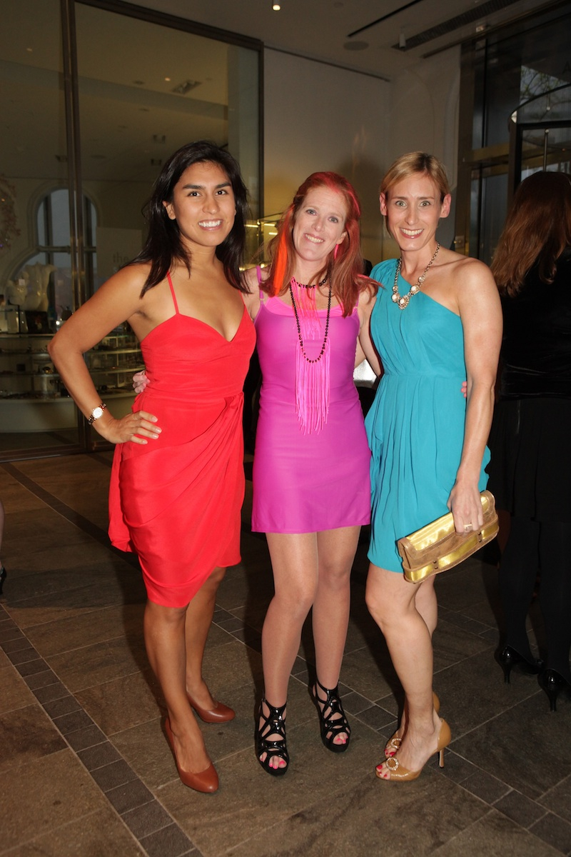 Cecily Carson and friends pose in the MAD lobby in their fluorescent attire before entering the FLUORESCENTBALL.